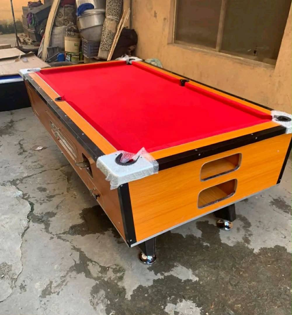 Wood finish snooker table with red cloth
